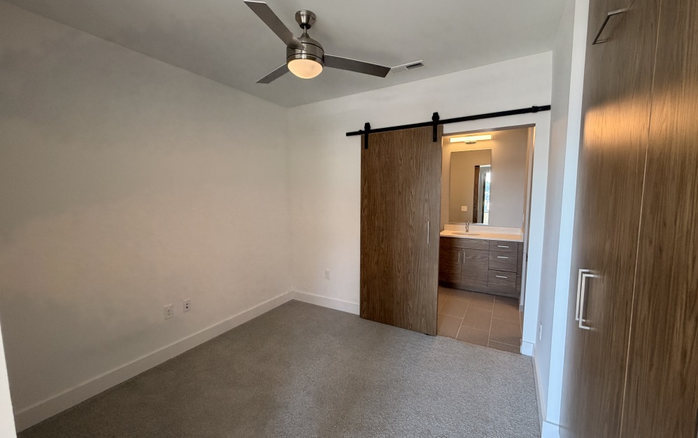 one bedroom apartment with ceiling fan and bathroom