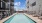 Sparkling pool in a courtyard with lounge seating
